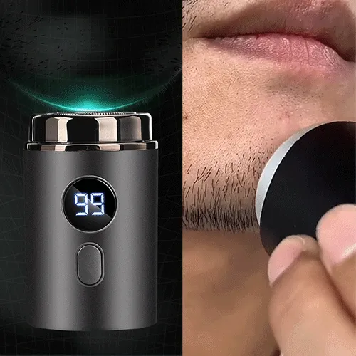 Mini electric shaver with LED battery display cutting hair closely in action